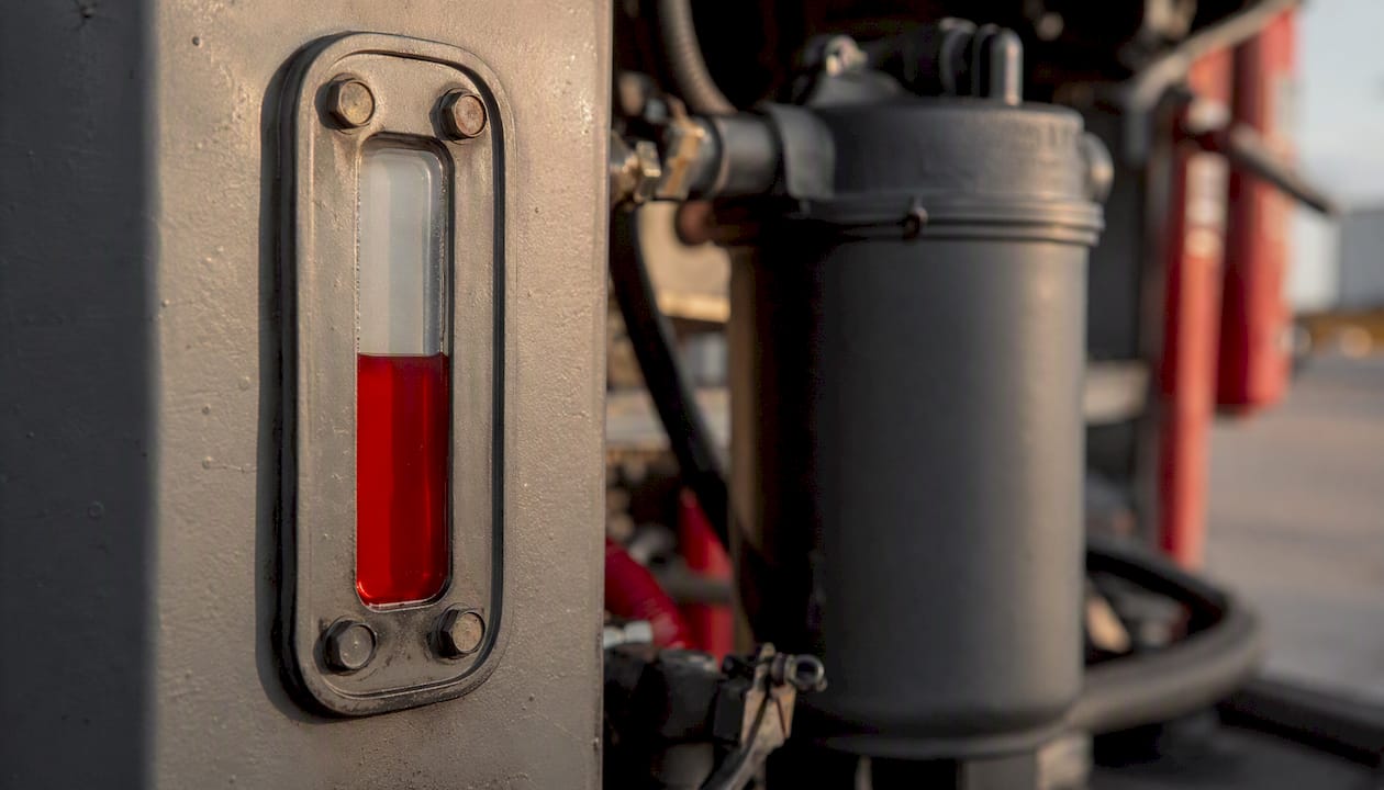 Red Diesel vs Green Diesel: Key Differences Explained 1 Close-up of dyed red diesel fuel gauge in tank