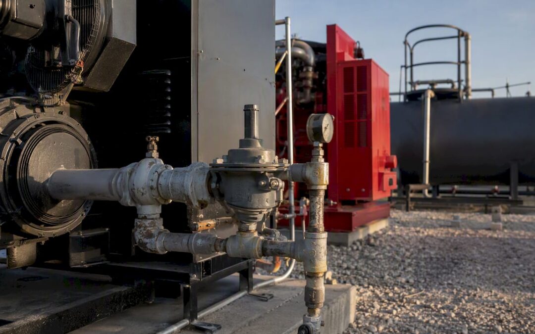 Outdoor industrial diesel and natural gas generators side by side