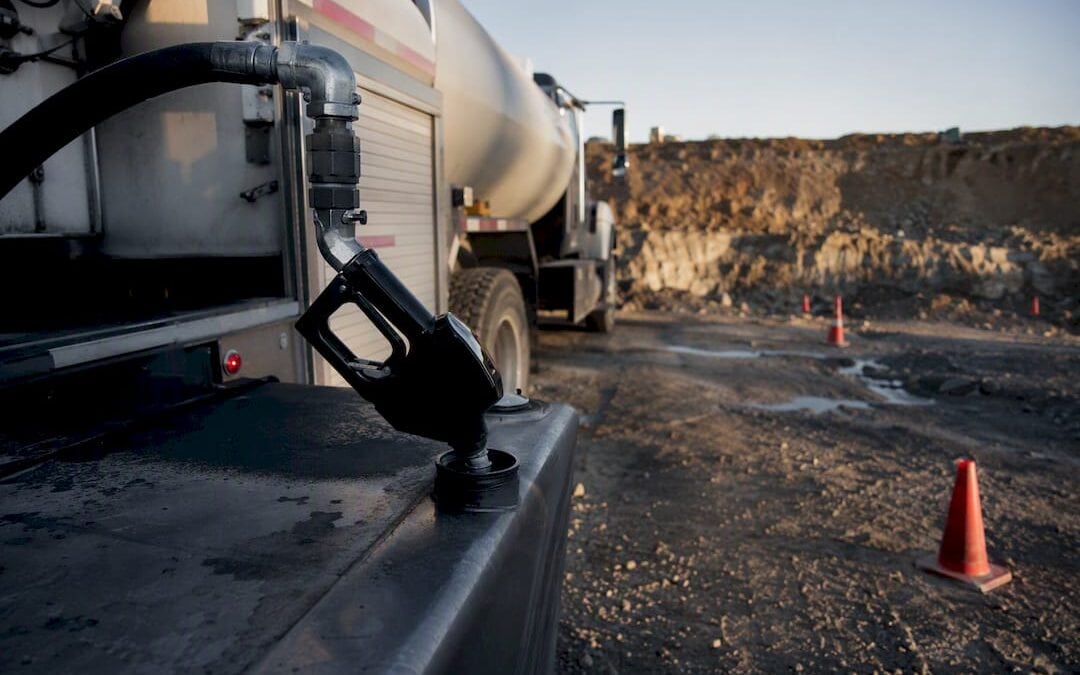 Diesel fuel delivery truck fueling a tank