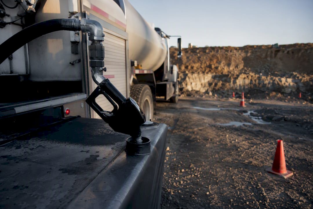 Diesel fuel delivery truck fueling a tank
