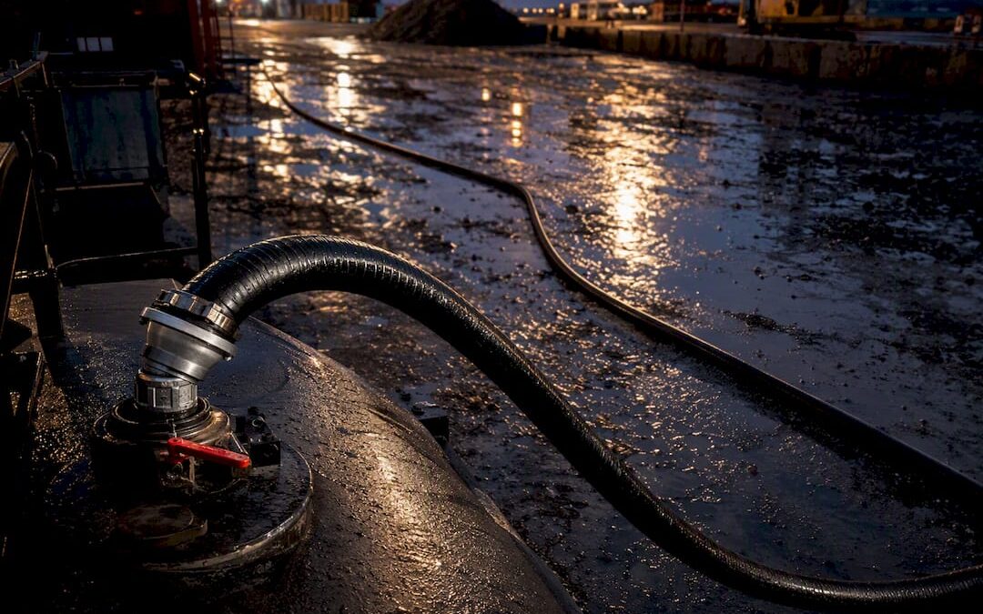 Fuel hose connected at a tank opening