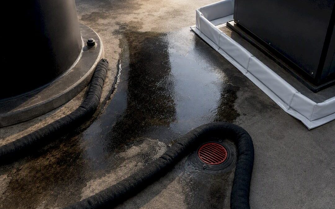 Diesel spill contained beside sealed drain