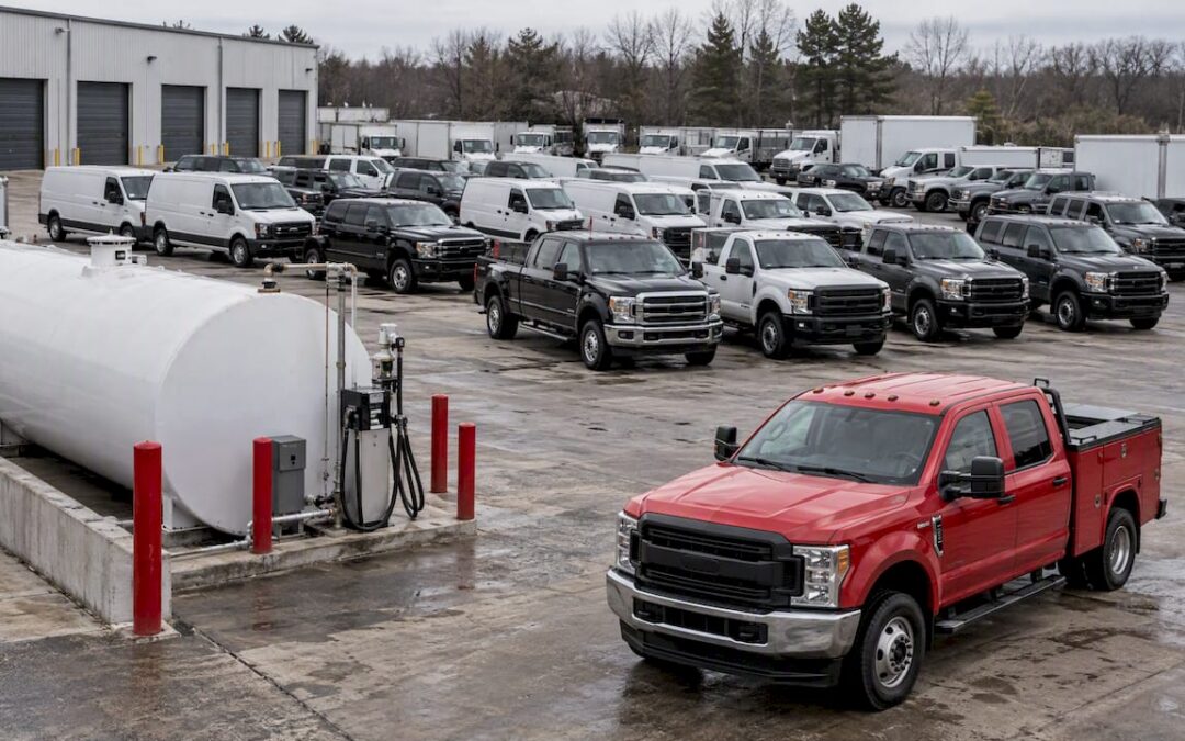 Unbranded fleet parked beside an on-site fuel tank