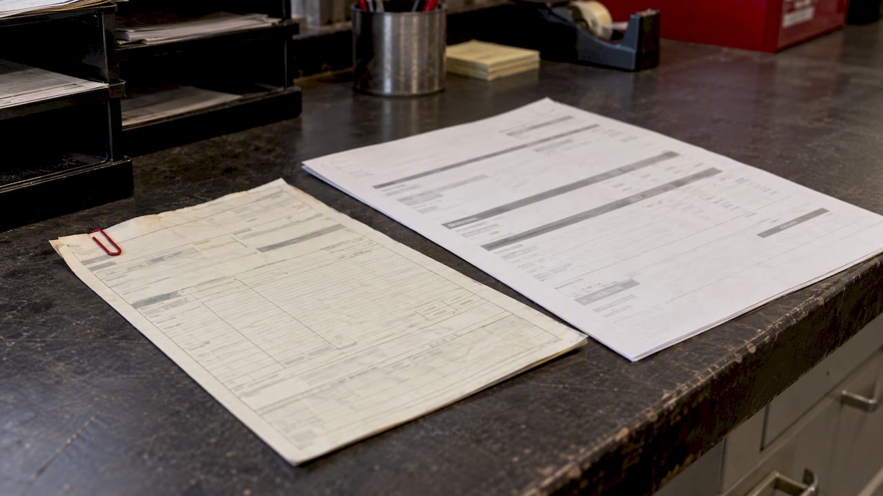 Fuel delivery ticket beside its invoice