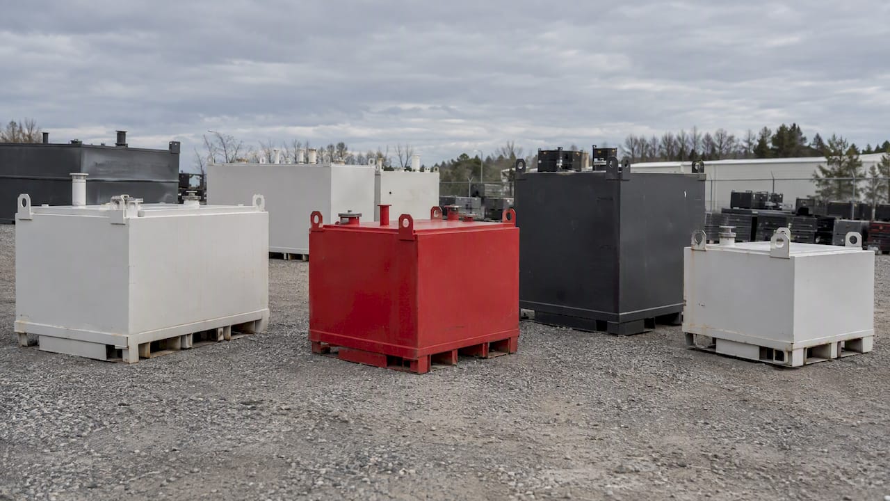 Unbranded rental fuel tanks in an equipment yard