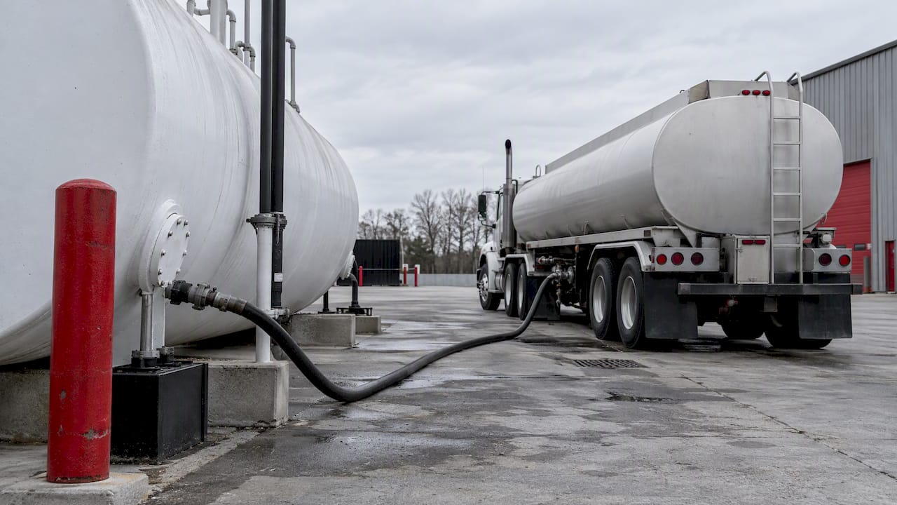 Fuel tanker beside an on-site diesel tank