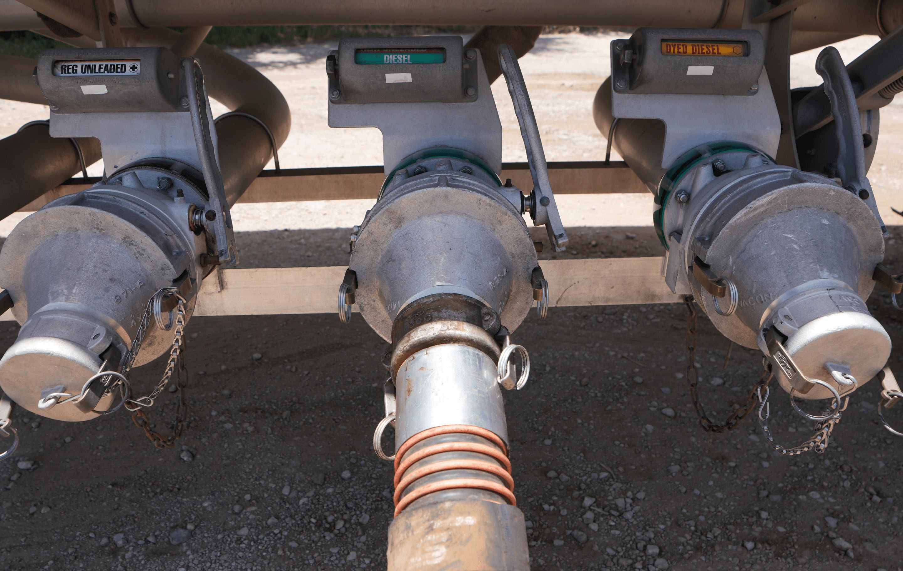 Different kinds of fuel being delivered from a disel truck