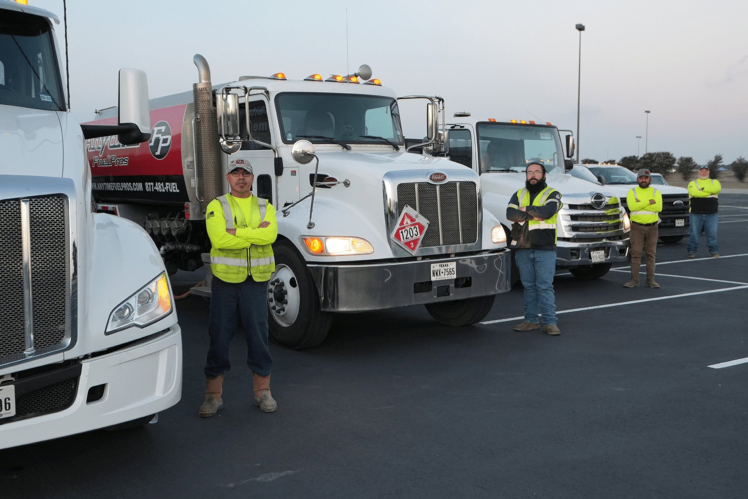 Drivers in front of fuel delivery fleet 2